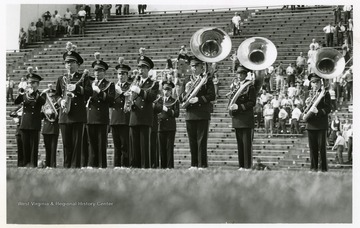 WVU marching band plays on the field.