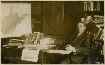 Dr. Callahan seated at his desk.