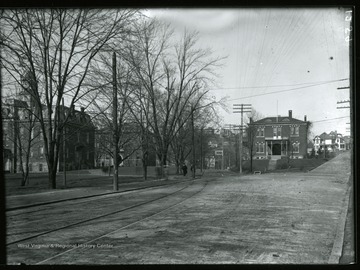 From left, Martin Hall, Science Hall (Chitwood Hall) and Agricultural Experiment Station; this picture is taken from the present site of Grumbein's Island. Note the trolley tracks in the foreground.