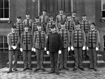 Cadet officers pose in front of Woodburn Hall.