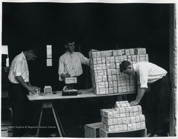Students prepare packages for postal delivery.
