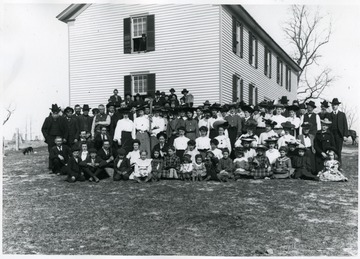 Students, teachers and neighbors gather on an occasion to plant school ground at Sinks Grove.