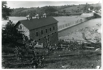 A one-story power plant and dam along the river. The dam was originlally built in 1832 for the C &amp; O Canal.