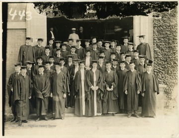 Group portrait of graduates wearing caps and gowns. 'Molby; Rufus A. West 170 Spruce Street, Morgantown, W. Va.'