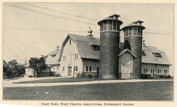 A view of dairy barn and silos of West Virginia Agricultural Experiment Station.