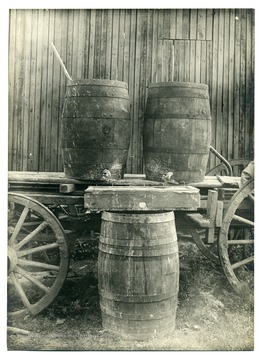 Barrels with spout on a cart.