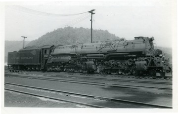A picture of series 1201-1212, type 4-6-6-4, class M-2 locomotive engine on Western Maryland Railway at Ridgeley, W. Va.  The engine is built by Baldwin Locomotive Works (no. 62453)in 1940 with following specification: wt--601,000lb; cyl.4-23x32; dri. 69"; T.F. 95,500 lb.; B.P. 250lb.  