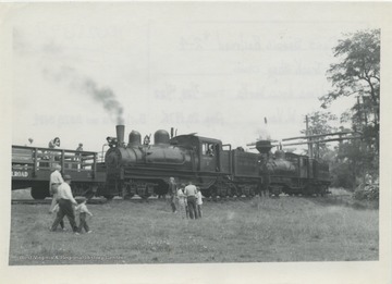 Type: 3 Truck Shay; Builder: Lima Locomotive Works; Year: 7/28, 12/22; Builder's No. 3373, 3189; Train climbing to Bald Knob, at rest stop.