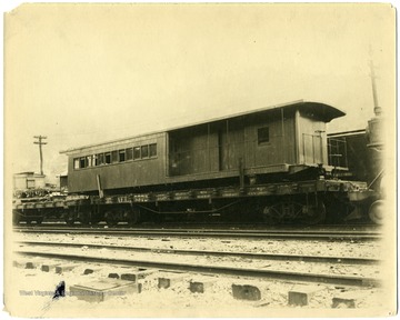 A flatcar is of Atlantic Coast Line and the car on top is Cumberland Valley Rail Road in Grafton train yard.
