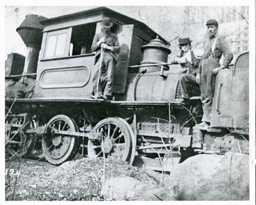 'The old double engine used on the Laurel Fork and Sand Hill R.R. Taken near high trestle, Wilch Rollin, fireman with whiskers; Bob Fleming, engineer; Oth Collin, passenger with cane. #2 Mas W. R. Sterling BLW 3222, 5-1873.'