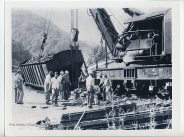 On the Cabin Creek branch in Kanawha County. Railroad Crane Lifting a Derailed Coal Car.