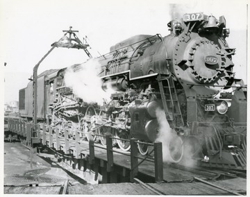Image from the collection of the Chesapeake and Ohio Historical Society. 'CSPR-280; L-2 Hudson #307 being turned on roundhouse turntable at Hinton, W. Va.'