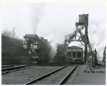 Image from the collection of the Chesapeake and Ohio Historical Society. 'Negative #CSPR-281; K-3 Mikado #1210 at Hinton, W. Va. beside the ash pit dumping ashes.  Good view of ash hoist.  March, 1946.'