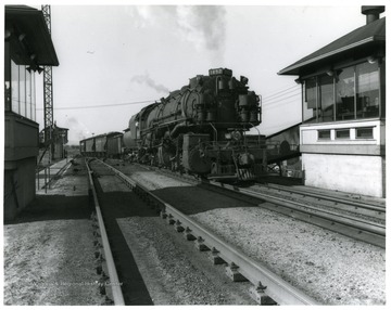 Image from the collection of the Chesapeake and Ohio Historical Society. 'CSPR-1372: H-4 2-6-6-2 Mallet #1452 with cut of coal on the Russel, Ky. Hump, February, 1948.'