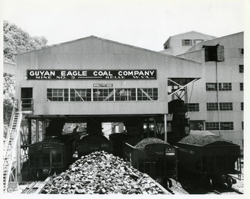 Image from the collection of the Chesapeake and Ohio Historical Society. 'CSPR-3417: Viw of Guyan Eagle Coal Co. Guyan #5 mine tipple, from atop C.&amp; O. hoppers being loaded.'