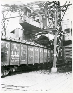 Image from the collection of the Chesapeake and Ohio Historical Society. 'CSPR-95: a closeup of coal tipple of Consolidation Coal Co. at Jenkins, Ky. loading coal into c/o gondola #41461.'