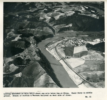 'Looking southwest at mile 201.3 about one mile below dam at Fries.  Blair ferry in middle ground.  Branch of Norfolk &amp; Western Railroad on west side of river.'