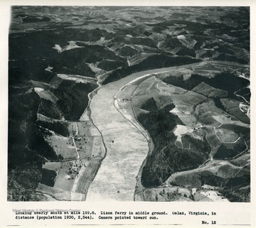 'Looking nearly south at mile 199.8.  Dixon ferry in middle ground.  Galax, Virginia, in distance (population 1930, 2,544).  Camera pointed toward sun.'