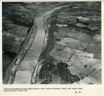 'Looking southwest at mile 168.4 about a mile below Allisonia; ferry just below town; camera pointed toward sun.'