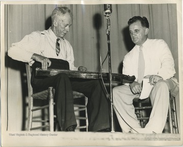 'Mr. H.B. Bryant, Canvas (Nicholas County). Mr. Bryant is playing the 'dulcimer' which he made. He makes an excellent instrument and sells it for $12.50. It is actually a rebec, an oriental instrument which was brought to England during the Crusades.'