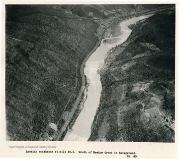'Looking southeast at mile 48.2.  Mouth of Meadow Creek in background.'