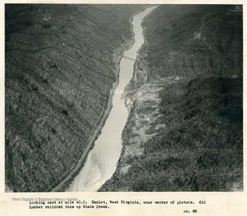 'Looking east at mile 43.5.  Hamlet, West Virginia, near center of picture.  Old Lumber Railroad runs up Glade Creek.'