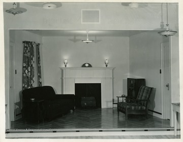 A display of living room with fireplace in the center.