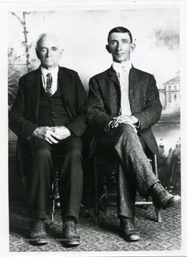 'H. B. Tharp, farmer on left, with his grandson-in-law, Ira D. Cox.'