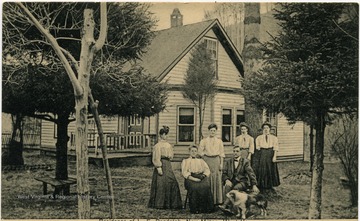 Picture shows Randolph and Wife with the 'Racket clerks.' Postcard sent to Mr. Geo. W. Albers, New Milton, W. Va. R. F. D. on June 19, 1913. Message: 'Your card to hand, Let the potatoes com first chance.'