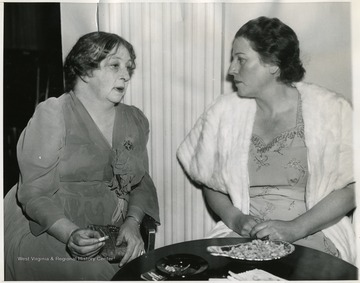 'Nobel Prize Winners at Anniversary Dinner: Sigrid Undset(Left), Nobel Prize winner in Literature for 1928; and Pearl Buck, winner of 1938, meet for a chat before the Nobel Anniversary Dinner held Dec. 10 in New York City, held by the common council for American Unity.  The Anniversary Dinner in the U.S. this year was given in lieu of the annual awards made in Oslo and Stockholm, but which were interrupted by the war.  Pearl Buck said that unless a "Miracle" occurs another war might develop after the present struggle to save freedom for the world.  There were 26 other Nobel Prize winners at the dinner.'