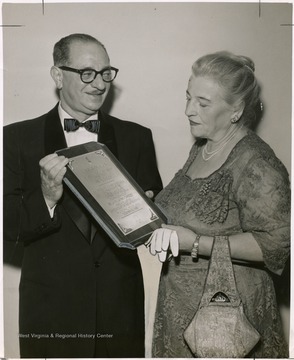 'Author Pearl Buck receives 1958 Benjamin N. Cardozo Award from Ralph M. Schwartzberg, honorary supreme chancellor of the Tau Epsilion Rho law fraternity, at dinner in Warwick Hotel.  Fraternity is holding its annual convention here.'