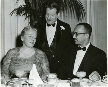 'Among notables present at the Ball were these three left to right Pearl S. Buck, Novelist; Dr. I.S. Ravdin, U. of Penna Medical Faculty; and Judge William Hastie.'