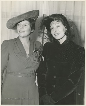 'Pearl Buck, left, noted author, and Luise Rainer, famous actress, make plans for the million-dollar drive launched by the China Emergency Relief Committee. The drive is for the benefit of the war-stricken people of China.  Miss Buck is chairman of the drive and Mrs. Franklin D. Roosevelt is honorary chairman.' 