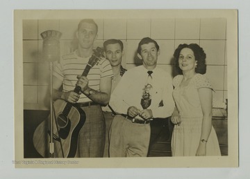 WPDX started in 1947. Roy Acuff is third from left.