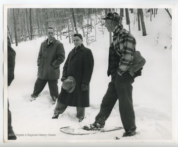 Man on right wearing snowshoes. Byrd papers duplicate.  Original at the R. C. Byrd Center for Legislative Studies, Shepherd University.