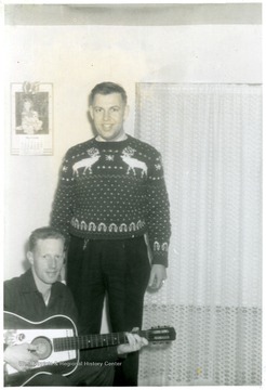 Junior Martin on the left with a guitar and Ken Carvell on the right.