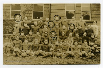 Group portrait of members of WVU Football team; those identified are 1) Phllips, Asst. Mgr.; 2) Hodges Q or HB; 3) Scott HB; 4)Smith E and 5) MacRae C.