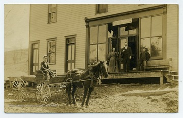 'Standing in doorway is William E. Rush, Postmaster Monongalia County: Population 101.'