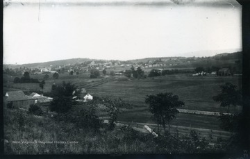 A photograph of a small town. '74 W.B.(29); July 25, 1884, Fri. 9:15 am'
