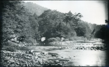 A photograph of a river with a horse and carriage on the left. '54 D(30); Thur. July 17, 1884 8 am'