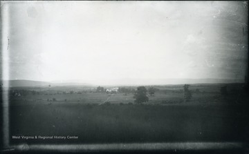 'Sheridan's headquarters, occupied in his absence by Gen. Emery and other officers in command. It is off to the West of the pike and in rear of formation of the 19th corps. The distant hill of No. 97 on the left. Our troops were driven across the field from the left towards the right; nearly parallel with the pike. 99.D.(61); July 30, 1884, Wednesday 12:15 clear'