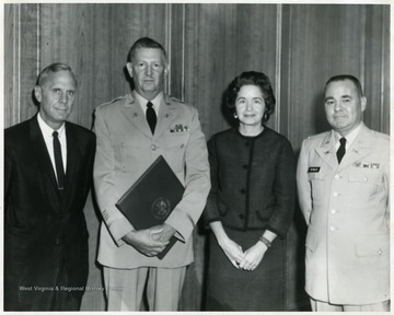 A portrait of Colonial Reynolds (first from right), Colonial Harvey Hartwig (second from right), Mrs. Hartwig (third from right) and President Miller (far left).