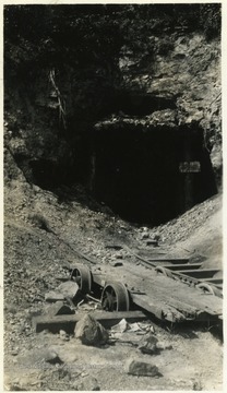 A photograph of the entrance to a railroad tunnel.