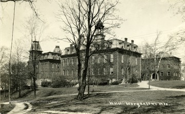 A photograph of the Downtown Campus of WVU, with Martin Hall in the foreground, Woodburn Hall to the left and Chitwood Hall on the Right.