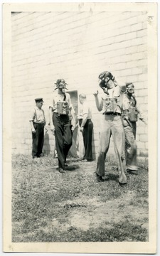 Men wearing breathing apparatus.