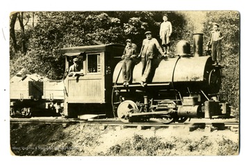 Engineers and others pose with a steam engine, the view is likely to be taken in Western Maryland.