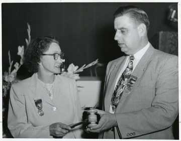 Henry Kiser (right) with an unidentified woman.