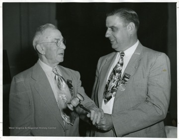 A photograph of Henry Kiser with an unidentified man.