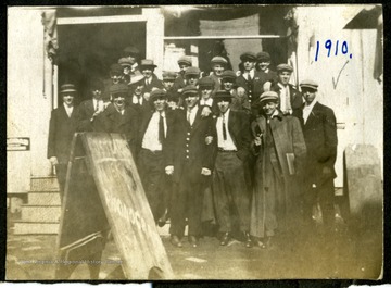 Group of unidentified man in front of Phonograph shop, Clarksburg, W. Va..