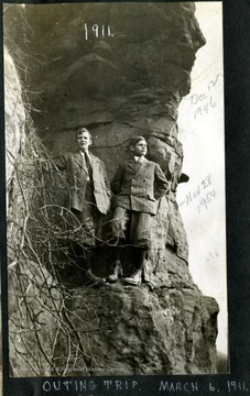 Two Clarksburg boys pose under a huge outcrop.